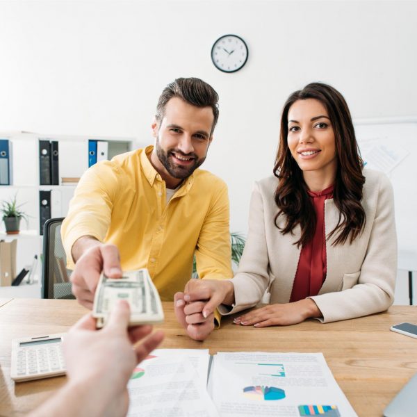 selective-focus-of-investors-couple-sitting-at-tab-2023-11-27-05-05-02-utc (1)