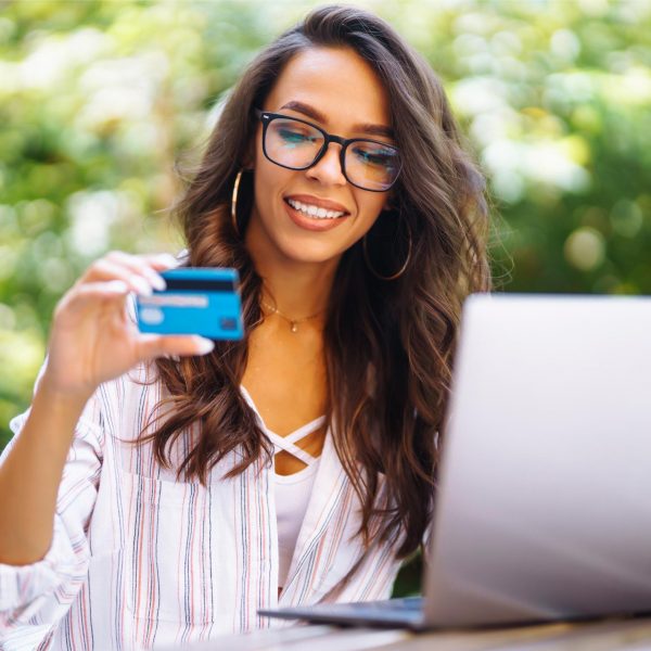 young-woman-sitting-at-cafe-making-online-shopping-2023-11-27-05-02-32-utc (1)